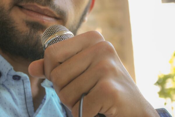 Man speaking into microphone