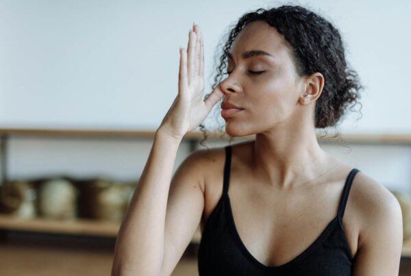 A woman doing breathing exercises