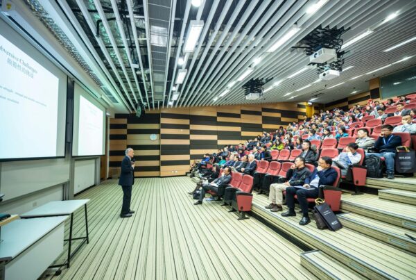 Man talking in front of a room full of people