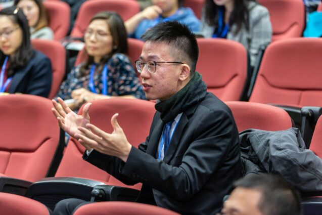 A man sitting while explaining