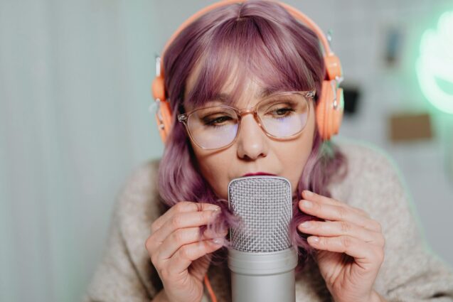 Woman talking to a microphone