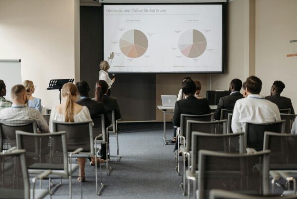 A speaker addresses a captivated audience during a presentation