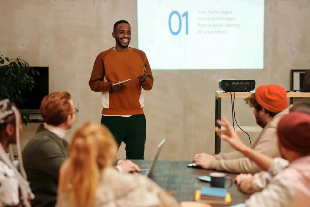 Man giving a presentation to a group in a meeting room