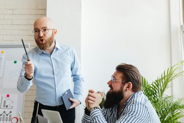 Man passionately presenting ideas to colleague during meeting