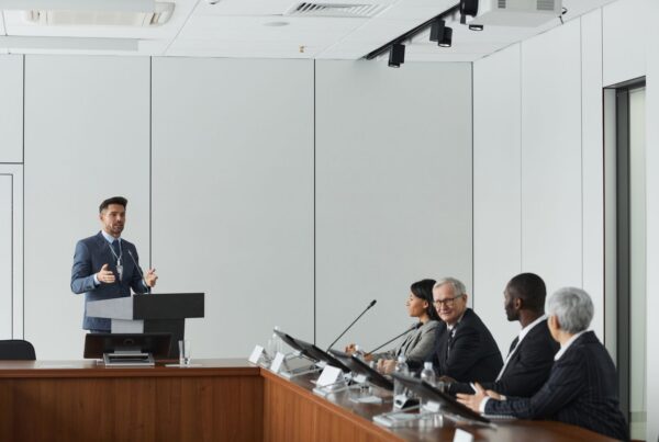 Businessman giving a presentation to a panel