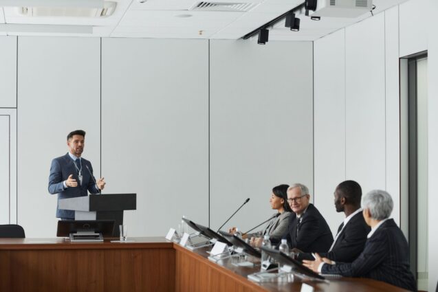 Businessman giving a presentation to a panel