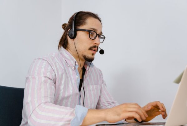 Man wearing a headset during an online call
