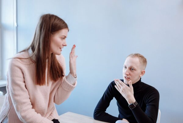 Man and woman having a face-to-face conversation