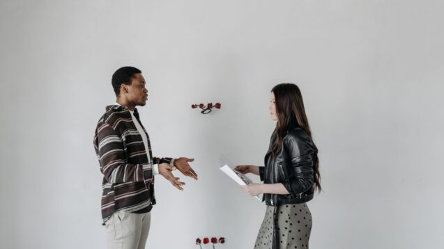 Man and woman having a face-to-face conversation